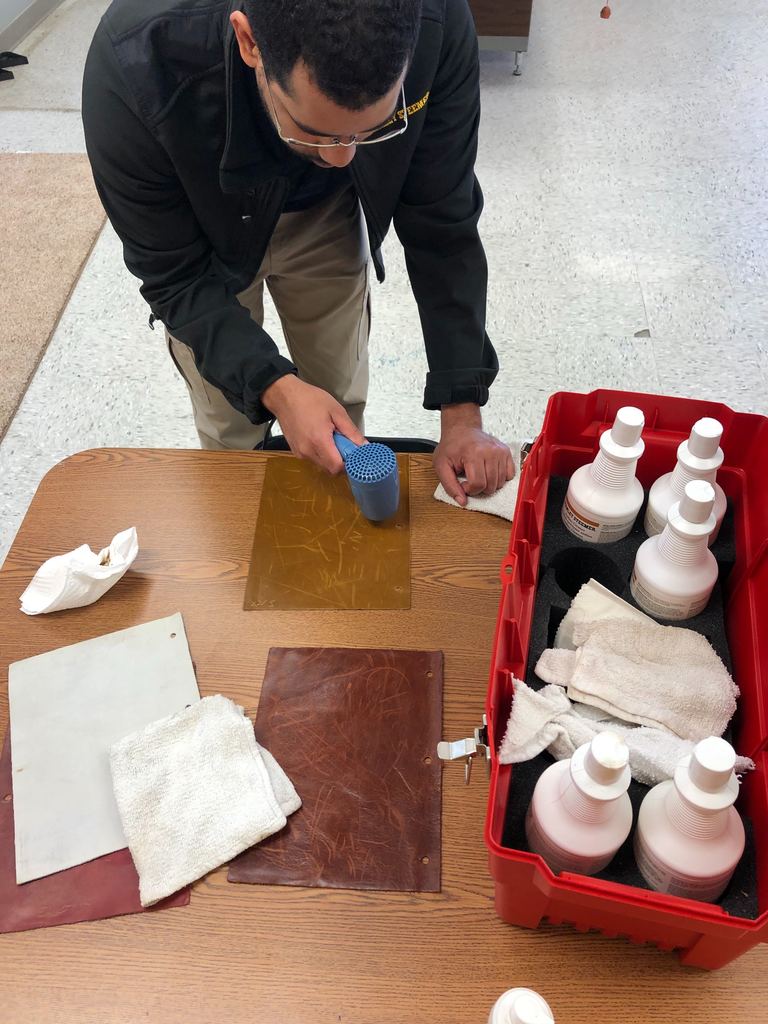 Technician learning about leather cleaning