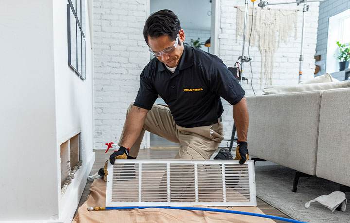 Stanley Steemer technician inspecting air ducts in Santa Rosa, CA home