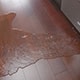 Water flooding out of a dishwasher on a kitchen floor. 