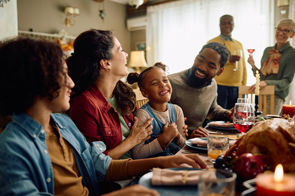 Hosting family enjoying holiday meal