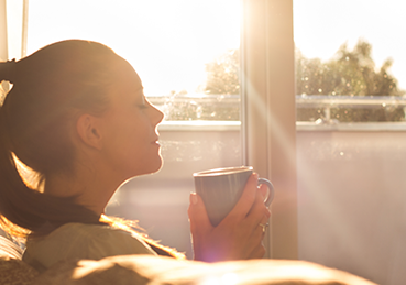 Woman breathing in cleaner indoor air